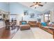 Spacious living room with vaulted ceiling, comfy couches, and hardwood floors at 5010 Windsor Green Way # 301, Myrtle Beach, SC 29579