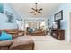 Living room with vaulted ceiling, fireplace, and access to balcony at 5010 Windsor Green Way # 301, Myrtle Beach, SC 29579