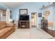 Living room with vaulted ceiling, fireplace, and built-in shelving at 5010 Windsor Green Way # 301, Myrtle Beach, SC 29579