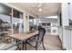 Screened balcony with table and chairs, overlooking community at 5010 Windsor Green Way # 301, Myrtle Beach, SC 29579