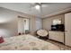 Bedroom with a full-size bed and comfy chair at 517 S Ocean Blvd. # 105, North Myrtle Beach, SC 29582