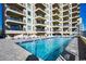 Large pool with plenty of lounge chairs, close to building at 517 S Ocean Blvd. # 105, North Myrtle Beach, SC 29582
