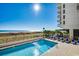 Relaxing pool with ocean views and resort-style amenities at 517 S Ocean Blvd. # 105, North Myrtle Beach, SC 29582