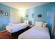 Bedroom with two twin beds and light blue walls at 517 White River Ct. # 22A, Myrtle Beach, SC 29579