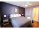 King bedroom with ceiling fan and access to bathroom at 517 White River Ct. # 22A, Myrtle Beach, SC 29579