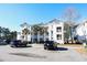 Two-story condo building with parking and landscaping at 517 White River Ct. # 22A, Myrtle Beach, SC 29579
