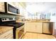 Modern kitchen with granite countertops and stainless steel appliances at 517 White River Ct. # 22A, Myrtle Beach, SC 29579