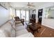 Living room features a sofa, recliner, and access to balcony at 517 White River Ct. # 22A, Myrtle Beach, SC 29579