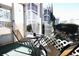 Screened-in patio with small table and chairs at 517 White River Ct. # 22A, Myrtle Beach, SC 29579