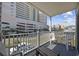 Balcony with seating, overlooking street and parking area at 5709 N Ocean Blvd. N # 202, North Myrtle Beach, SC 29582