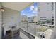 Relaxing balcony with seating, overlooking the street and buildings at 5709 N Ocean Blvd. N # 202, North Myrtle Beach, SC 29582