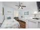 Twin bedroom with coastal decor and a ceiling fan at 5709 N Ocean Blvd. N # 202, North Myrtle Beach, SC 29582