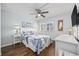 Bedroom with a queen bed, ceiling fan and coastal decor at 5709 N Ocean Blvd. N # 202, North Myrtle Beach, SC 29582