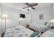 Twin bedroom with coastal bedding and ceiling fan at 5709 N Ocean Blvd. N # 202, North Myrtle Beach, SC 29582