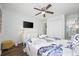 Bedroom with queen bed, ceiling fan, and coastal decor at 5709 N Ocean Blvd. N # 202, North Myrtle Beach, SC 29582