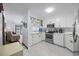 Bright kitchen with stainless steel appliances and white cabinets at 5709 N Ocean Blvd. N # 202, North Myrtle Beach, SC 29582