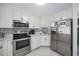 Stainless steel appliances and white cabinets at 5709 N Ocean Blvd. N # 202, North Myrtle Beach, SC 29582