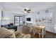 Living room with hardwood floors, dining area, and balcony access at 5709 N Ocean Blvd. N # 202, North Myrtle Beach, SC 29582