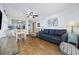 Bright living room with hardwood floors, comfy seating, and built-in shelving at 5709 N Ocean Blvd. N # 202, North Myrtle Beach, SC 29582