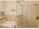 Spa-like bathroom with soaking tub, walk-in shower, and stylish tile at 600 48Th Ave. S # 403, North Myrtle Beach, SC 29582