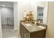 Simple bathroom with granite countertop, single sink, and built-in shelving at 600 48Th Ave. S # 403, North Myrtle Beach, SC 29582