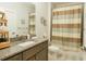 Clean bathroom with granite countertop, shower, and updated fixtures at 600 48Th Ave. S # 403, North Myrtle Beach, SC 29582