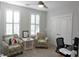 Bright bedroom with comfortable armchairs, plenty of natural light, and plantation shutters at 600 48Th Ave. S # 403, North Myrtle Beach, SC 29582