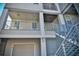 Modern townhome exterior featuring stairs and balcony at 600 48Th Ave. S # 403, North Myrtle Beach, SC 29582