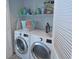 Bright laundry room with washer, dryer, and shelving at 600 48Th Ave. S # 403, North Myrtle Beach, SC 29582