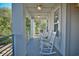 Relaxing porch with rocking chairs overlooking the community at 600 48Th Ave. S # 403, North Myrtle Beach, SC 29582