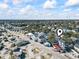 Wide aerial view of the property and its surroundings, including nearby buildings at 6001 South Kings Hwy., Myrtle Beach, SC 29575