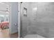 Shower with grey tile and glass enclosure at 6001 South Kings Hwy., Myrtle Beach, SC 29575
