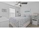 Bright bedroom with a ceiling fan and comfortable bedding at 6001 South Kings Hwy., Myrtle Beach, SC 29575