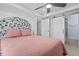 Bedroom with a floral headboard and access to the bathroom at 6001 South Kings Hwy., Myrtle Beach, SC 29575