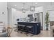 Modern kitchen with white cabinets, a large island, and stainless steel appliances at 6001 South Kings Hwy., Myrtle Beach, SC 29575