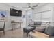Living room with comfy seating, large TV and sliding door to balcony at 6001 South Kings Hwy., Myrtle Beach, SC 29575