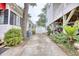 Backyard with a shed, tropical plants, and space for parking offers a functional and attractive outdoor area at 6001-Z16 S Kings Hwy., Myrtle Beach, SC 29575