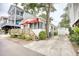 Charming beach house featuring a lovely wooden porch, red awning, and white exterior at 6001-Z16 S Kings Hwy., Myrtle Beach, SC 29575