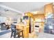 Galley kitchen boasts wood cabinets, stainless appliances, bar seating, and cozy breakfast nook at 6001-Z16 S Kings Hwy., Myrtle Beach, SC 29575