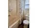 Bathroom with a tub, shower, toilet and seashell-themed curtain at 9502 Knights Ct., Myrtle Beach, SC 29572