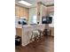 View of kitchen with wood cabinets, breakfast bar, and appliances at 9502 Knights Ct., Myrtle Beach, SC 29572