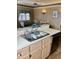 Kitchen with double sink, dishwasher, and view into living room at 9502 Knights Ct., Myrtle Beach, SC 29572