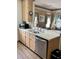 Kitchen features light wood cabinets, stainless steel dishwasher, and a microwave at 9502 Knights Ct., Myrtle Beach, SC 29572