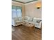 Living room boasts a sectional sofa, coffee table, and wood flooring at 9502 Knights Ct., Myrtle Beach, SC 29572