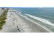 Aerial view of a wide sandy beach with ocean waves at 1001 World Tour Blvd. # 101A, Myrtle Beach, SC 29579