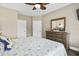 Bedroom with king-size bed, dresser, and double doors at 1001 World Tour Blvd. # 101A, Myrtle Beach, SC 29579