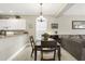 Kitchen and dining area with four chairs and a view into the living room at 1001 World Tour Blvd. # 101A, Myrtle Beach, SC 29579