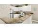 Modern kitchen with granite countertops and stainless steel appliances at 1001 World Tour Blvd. # 101A, Myrtle Beach, SC 29579