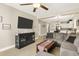 Open living room featuring a sectional sofa and a large TV at 1001 World Tour Blvd. # 101A, Myrtle Beach, SC 29579