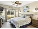 King-size bed, coastal decor, and sliding glass doors in this bedroom at 1001 World Tour Blvd. # 101A, Myrtle Beach, SC 29579